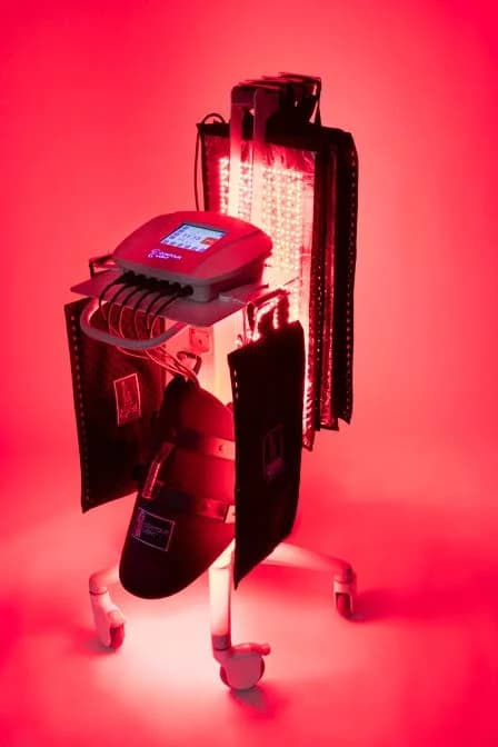 The clinic’s Contour Light system on its rolling stand, the LED panels lit red